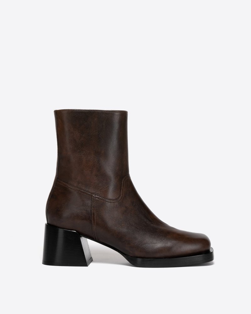 Brown ankle boot with a black heel on a white background