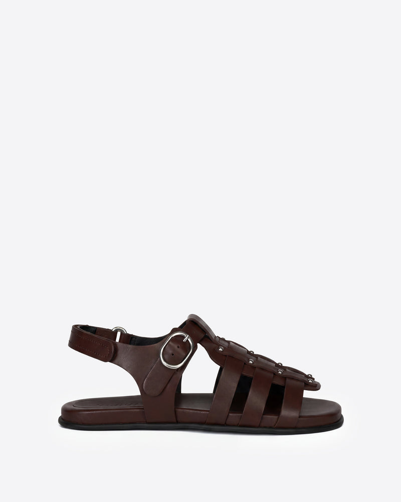 Brown sandal with a buckle on a white background