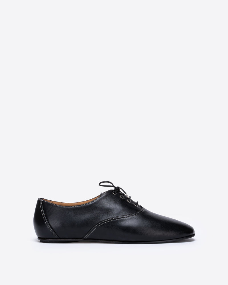 Black leather shoe on a white background