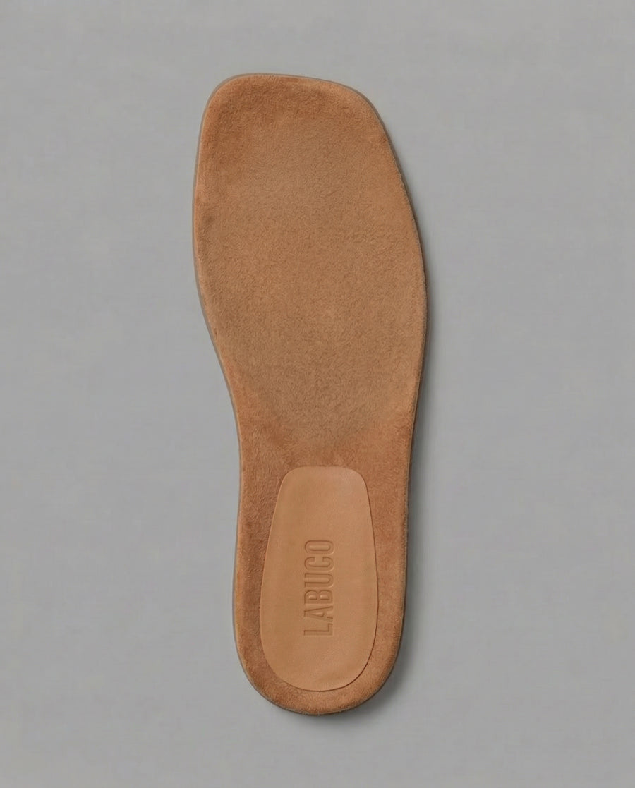 Cushioned insole with subtle arch support